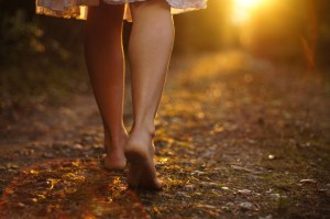 woman-walking-down-path-shutterstock_92746561