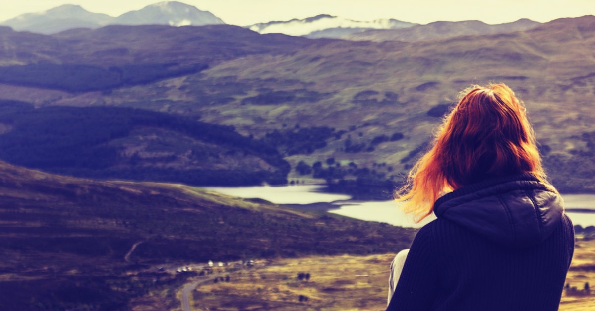 13495-woman-sitting-mountain-valley-looking-cold-outside-1200w-tn